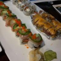 Surf and Turf Roll · Lobster tempura and asparagus roll topped with seared filet mignon glazed in spicy and a spr...