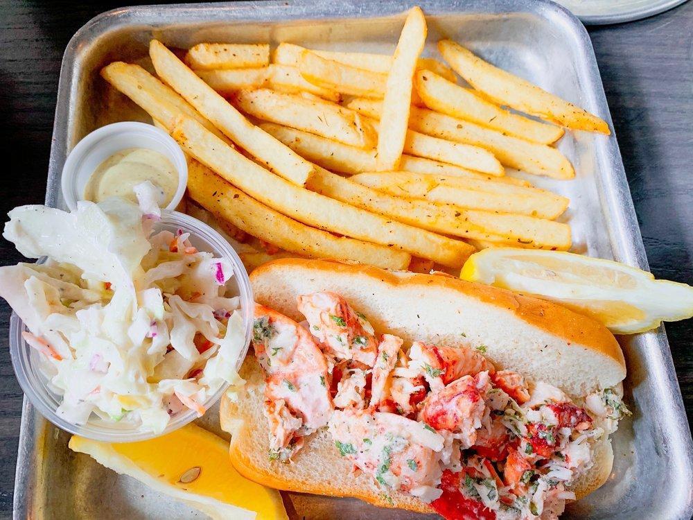 Lobster Roll · Just like many other things from the Northeast, it moved south and acquired southern flair a lobster roll served on a toasted split bun with a side of sauce.