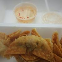 Crab Rangoon · Crispy wontons stuffed with crab meat, cream cheese, celery, red onions, and carrots. Served...