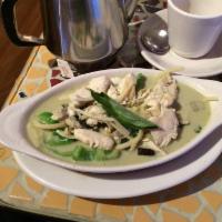 Green Curry · A delicious spicy curry with coconut milk, eggplant, bamboo shoots, bell peppers and fresh b...