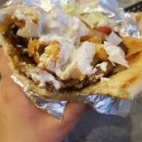 Gyro · Gyro meat with lettuce, tomato, onion, white sauce and hot sauce on pita bread