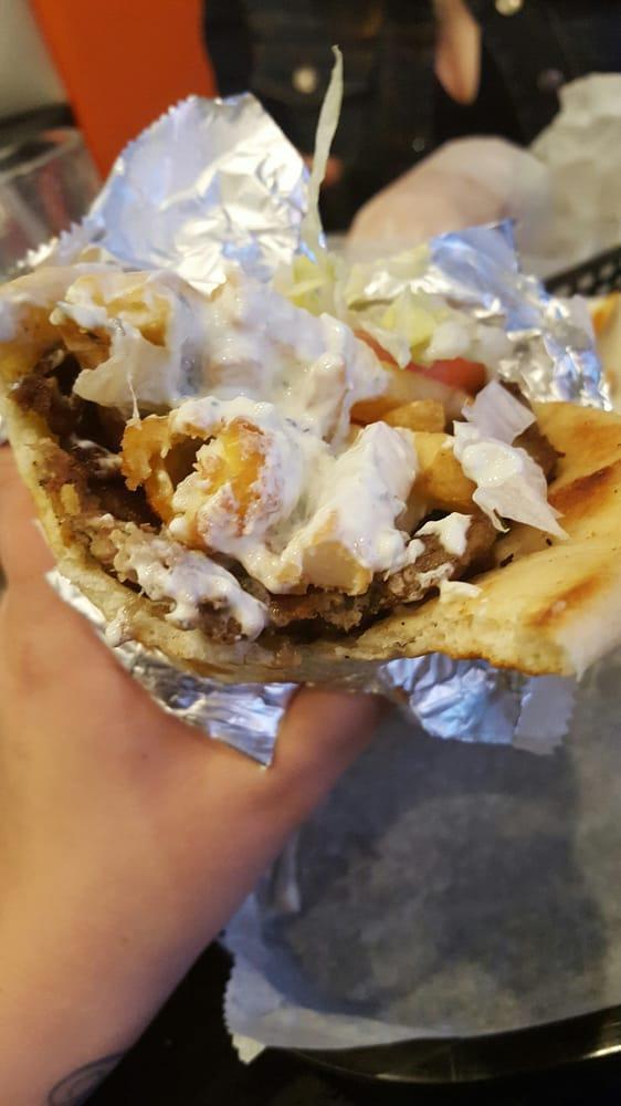 Gyro · Gyro meat with lettuce, tomato, onion, white sauce and hot sauce on pita bread