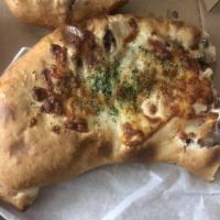 Steak Calzone Everything · Philly steak, cheese, mushroom, onions, green pepper sauce, Includes one marinara on the sid...