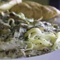 Fettuccine Alfredo · Our Fettuccine Alfredo is prepared with fresh Alfredo sauce topped with parmigiana cheese on...