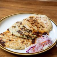Pupusas · 3 traditional Salvadorian thick corn tortillas stuffed with your choice of savory filling, a...