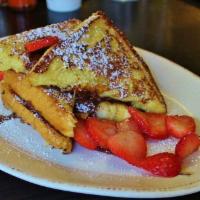 Nutella Stuffed French Toast · Thick slices of french toast sandwiched together, stuffed with Nutella and bananas then topp...