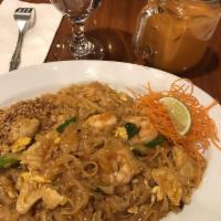 Pad Thai · Stir-fried Thai rice noodle with chicken and shrimp, eggs, ground peanut, green onions, red ...