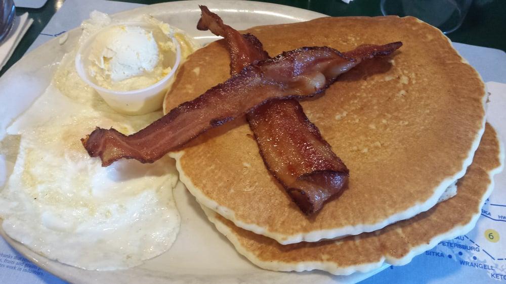 2 Hot Cakes, 2 Eggs And 2 Strips Of Bacon Or Link Sausages · 