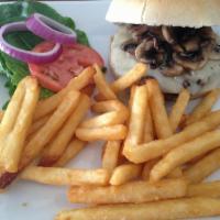 Mushroom Swiss Burger · Fresh grilled Hereford beef patty topped with sauteed mushrooms and Swiss cheese with red on...