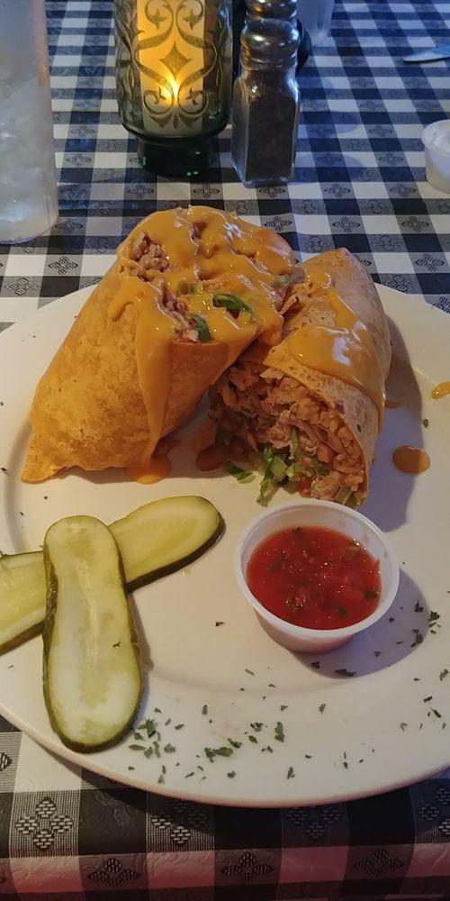 Cubano Burrito · Slow roasted pork, ham, black beans, rice, lettuce and tomato topped with cheddar cheese. Pickles on the side.