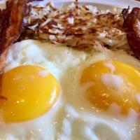 222 Breakfast · 2 eggs served with hash brown, bacon or sausage and French toast or pancakes.