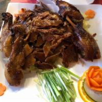 Peking Duck · Whole. The best in the area. The duck is served with hot buns plum sauce and scallion. Extra...