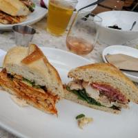 Noble Club Sandwich · Traditional chicken, hand-cut bacon, roasted tomatoes, pickled red onion, mixed greens, garl...