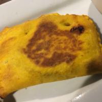 Spicy Jamaican Beef Patty · Seasoned ground beef wrapped in a flaky pastry crust.
