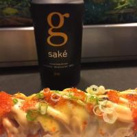 Lion King Roll · Baked. Inside: Crab mix and avocado. Outside: Salmon, tobiko, green onion. Sauce: Creamy Par...