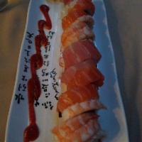 Santa Teresa Roll · Inside: Spicy tuna and cucumber. Outside: Tuna, salmon, shrimp and Sriracha on the side.