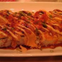 Baked Scallop Roll · Baked. Inside: crab mix and avocado. Outside: Scallop, green onion and tobiko. Sauce: Creamy...