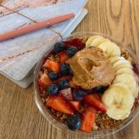 Classic Acai Berry Bowl · Acai berry blend of organic acai, banana, mixed berries, and almond milk - topped with straw...