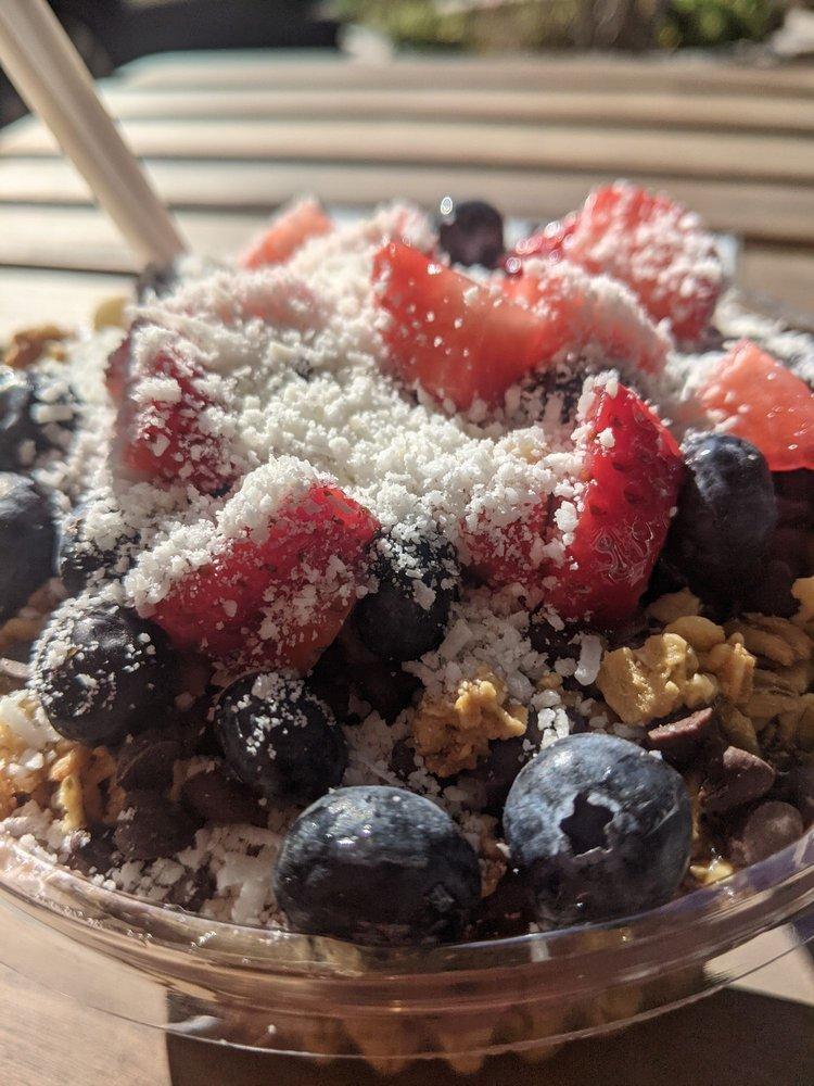 Sweet Tooth Acai Bowl · Chocolate PB (Peanut Butter) blend of acai, banana, cocoa powder, peanut butter and almond milk blended - topped with granola, chocolate chips, strawberry, blueberry, coconut flake & your choice of honey or agave.