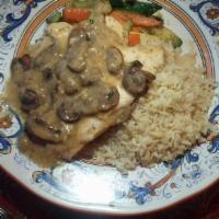 Chicken Marsala · Boneless chicken breast sauteed in extra virgin olive oil with roasted garlic and sliced mus...