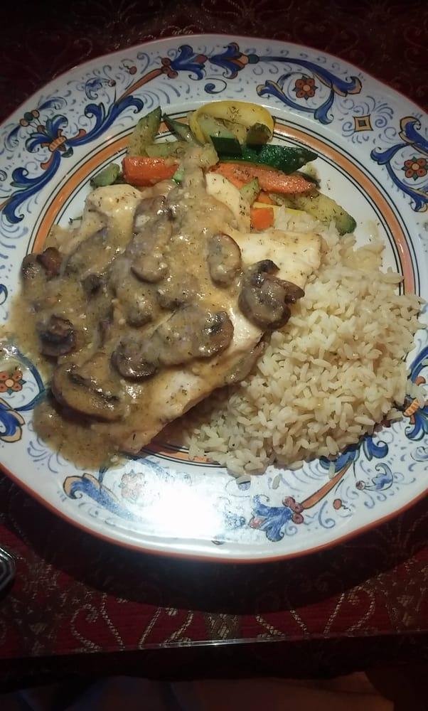 Chicken Marsala · Boneless chicken breast sauteed in extra virgin olive oil with roasted garlic and sliced mushrooms finished with marsala wine sauce served with your choice of starch and vegetable or served over your choice of pasta.