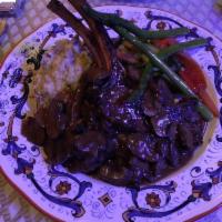 French Style Spring Lamb Confit · Tender and juicy lamb chops grilled to your liking finished in a fresh herb red wine mushroo...