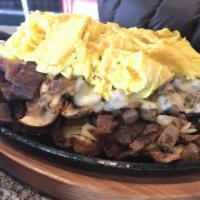 Ultimate Skillet · Bacon, sausage, mushroom, bell pepper, onion and pepper Jack cheese served on a bed of hash ...