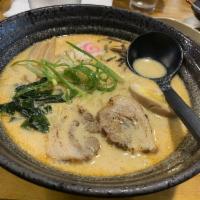 Tan Tan Ramen · Porkbone broth, seared cha-shu pork belly, bamboo, wakame, tamago, fish cake and corn.