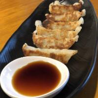 Gyoza · 6 pieces. Steamed and panfried pork and chicken potstickers.