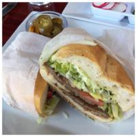 Carne Asada Torta · Grilled steak 0r milanesa. Mexican sandwich with spread of guacamole, beans, melted cheese, ...