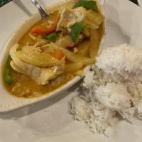 Yellow Curry · Mild. Coconut milk, onions, bell peppers, potatoes and tomatoes. Served with steamed rice.