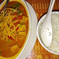 Red Curry · Coconut milk with bamboo shoots, bell peppers, accented with basil leaves. Served with steam...
