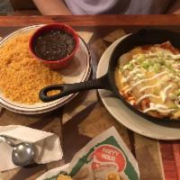 Enchilada · Chicken or beef. Served with 2 sides black or fried beans, guacamole salad with sour cream, ...