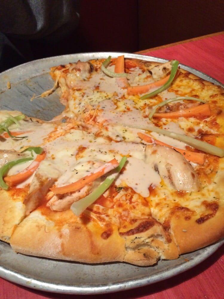 Buffalo Chicken Pizza · Hot sauce, chicken, bacon and Gorgonzola, mozzarella, fontina cheeses, served with side Gorgonzola dressing,. Garnish with carrots and celery sticks.