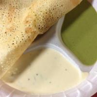 Masala Dosa · Crepe made out of rice, lentil filled with seasoned onions and potatoes. Served with coconut...