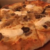 Wild Mushroom Truffle Pizza · Wild mushrooms, caramelized onions, Asiago cheese, ricotta cheese.