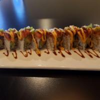 Jenny Roll · Spicy albacore, cucumber and avocado topped with spicy tuna, eel sauce, spicy mayo, ponzu an...