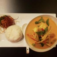 Red Curry · Red curry paste, thai basil leaves, bell peppers, bamboo shoot and a choice of protein in co...