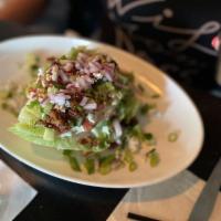 Wedge Salad · Crispy Bacon, Tomatoes, Cucumbers, Blue Cheese Crumbles, Blue Cheese Dressing