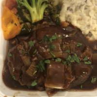 Osso Buco · Tender beef shank baked in celery, carrots and marsala wine.