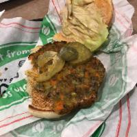 Veggie Burger · All veggie and purely delicious! Veggie patty, crisp lettuce, freshly sliced tomatoes, dill ...
