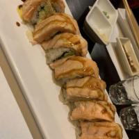 Baked Salmon Roll · In: imitation crab, cucumber and avocado. Out: baked salmon and cheese on top, eel sauce and...