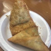 Chicken Samosa · 2 pieces. Triangular puffed pastry stuffed with spiced chicken.