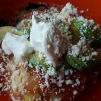 Huevos Rancheros · 3 Stacked Corn Tortillas | Black Beans | Eggs Over-Medium | Queso Blanco | Monterey Jack Che...