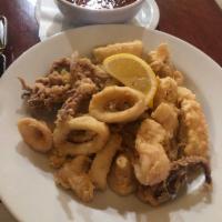 Fried Calamari · Tender calamari lightly breaded and flash fried, served with our house made arrabbiata sauce.