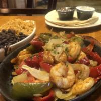 Fajitas · Served with flour tortillas, black beans, Mexican rice, sour cream and fresh pico de gallo s...