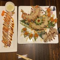 Shaggy Dog Roll · Shrimp tempura, cucumber, cream cheese, topped with crab sticks, wasabi mayo, eel sauce, spi...