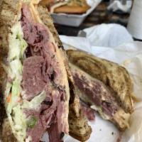 Joe King's Pastrami Sandwich · Hot pastrami, cole slaw, red onion, Russian dressing and Swiss cheese on toasted, seeded rye.