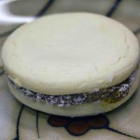 Alfajores · Shortbread cookie sandwich filled with dulce de leche.