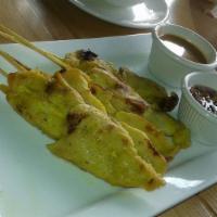 Chicken Satay · Grilled chicken on skewers served with peanut sauce and cucumber relish.